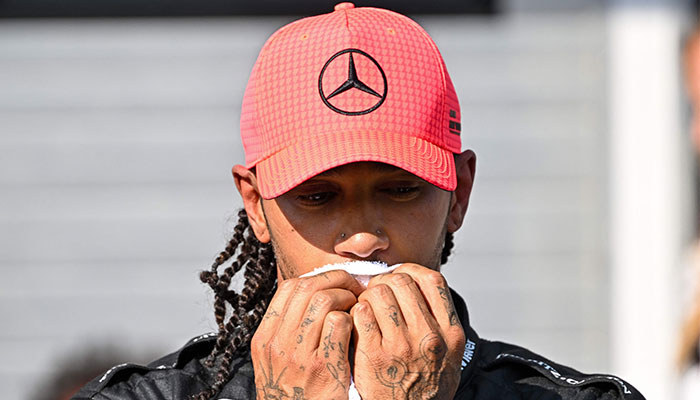 Mercedes´ British driver Lewis Hamilton wipes his face with a towel after the qualifying session at the Hungaroring race track in Mogyorod near Budapest on July 22, 2023, ahead of the Formula One Hungarian Grand Prix.—AFP