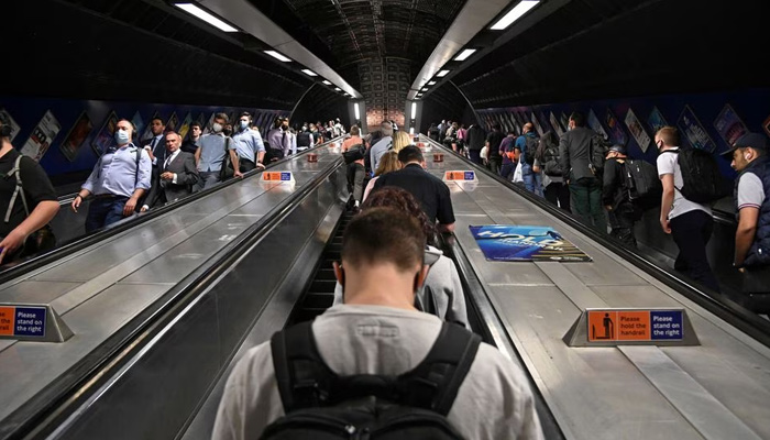 Workers travel through London Bridge rail and underground station during the morning rush hour in London, Britain, September 8, 2021. — Reuters