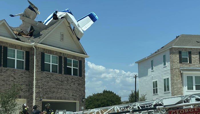 Plane debris can be seen on the roof of a house after it crashed on July 23, 2023. — Facebook/Georgetown Texas Fire Department