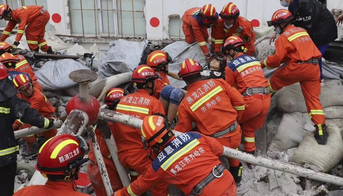 Rescue people conducting operations, searching for survivors from the rubble after the roof of a gymnasium in the province of Heilongjiang collapsed on July 23, 2023. — Twitter/XHNews