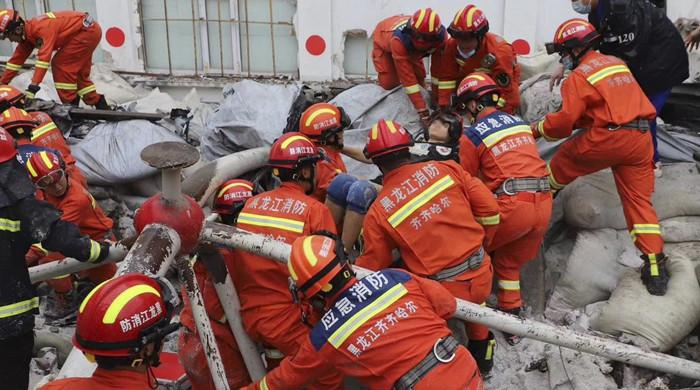 China gym roof collapse kills 11 as rescuers dig for bodies, survivors