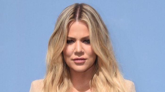Khloe Kardashian adds a pop of colour with a pink bodysuit at