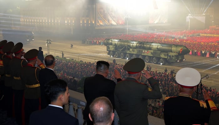 Kim Jong Un oversees the military parade alongside Russian and Chinese officials held in Pyongyang to mark the 70th anniversary of the Korean War, featuring a nuclear-capable ICBM on July 28, 2023. — KCNA