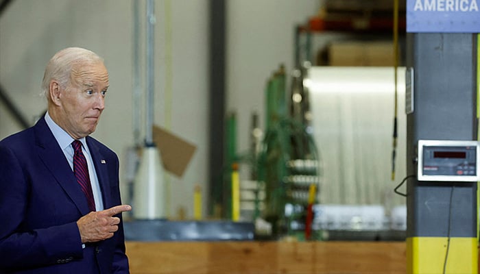 US President Joe Biden points, as he attends a press conference to deliver remarks on the economy at Auburn Manufacturing, a company that produces heat- and fire-resistant fabrics for a range of industrial uses in the US and abroad, in Auburn, Maine, US July 28, 2023. — AFP