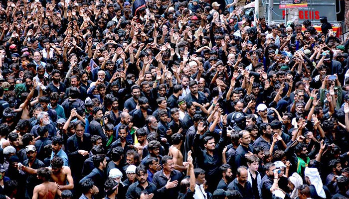 A large number of Shia Muslims participate in 10th Muharram procession to mark Ashoura at Mehfil-e-Husseini Road in Hyderabad on July 29, 2023. — APP