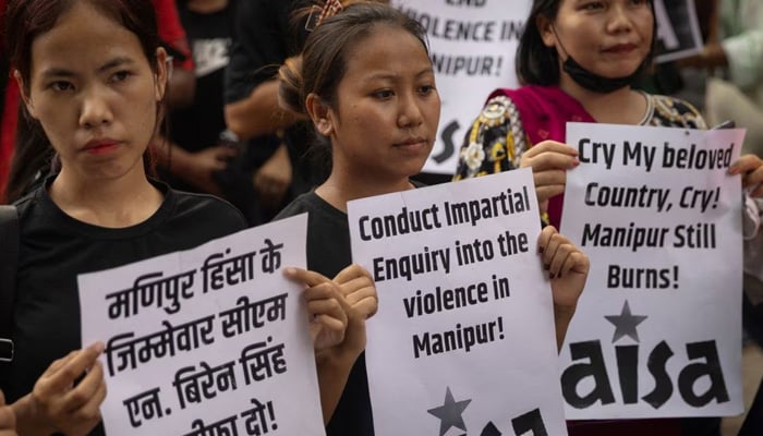 Protestors hold placards as they attend a protest against the alleged sexual assault of two tribal women in the eastern state of Manipur, in New Delhi, India, July 21, 2023. — Reuters