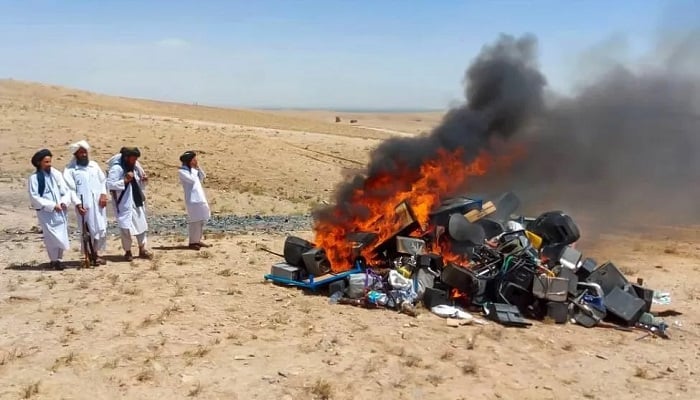 This undated image shows Taliban burning musical instruments, players, amplifiers, and speakers. — Twitter/Taliban