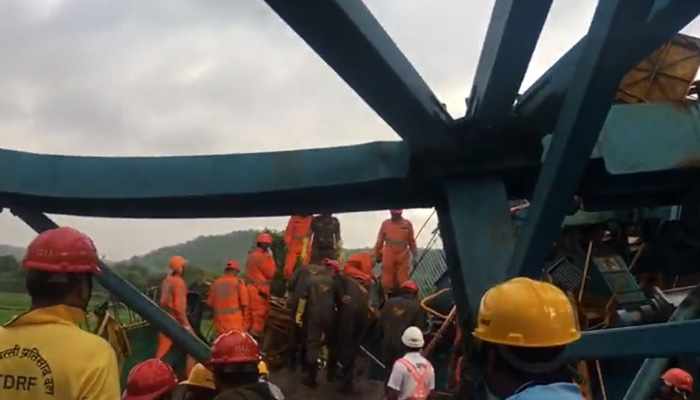 Rescue workers recover the dead and injured buried under the collapsed crane in Mumbai on August 1, 2023, in this still taken from a video. — Twitter/@IndianExpress