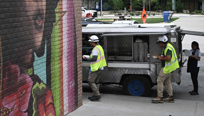 Construction workers take a break in Washington, DC, on July 27, 2023. — AFP/Files