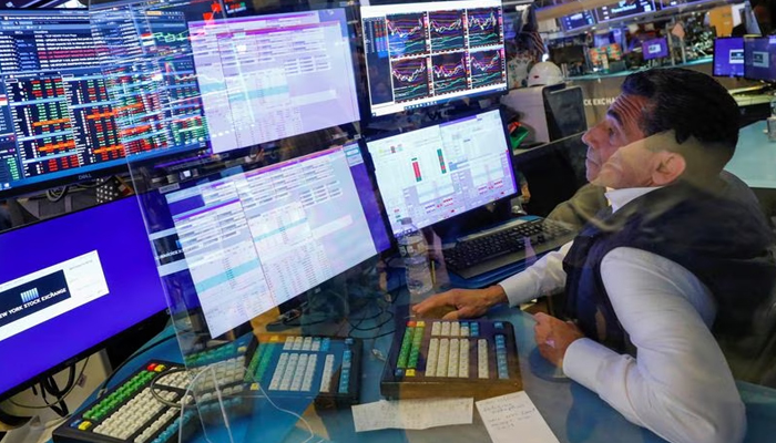 A trader works behind plexiglass on the floor of the New York Stock Exchange (NYSE) in New York City, New York, US, July 28, 2021. — Reuters