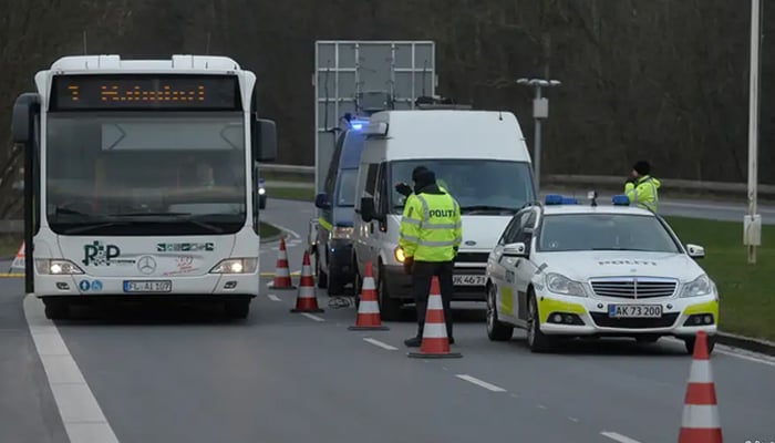 This picture shows Danish Police checking vehicles as they enter the country. — Reuters/Filee