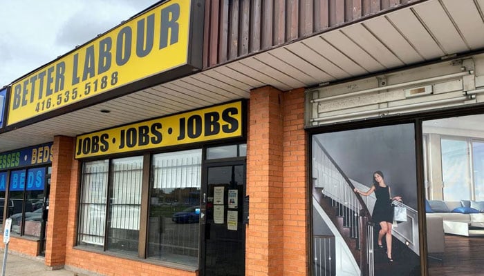 A view of an illustration outside a wood flooring sales office next to an employment agency in Toronto, Ontario, Canada October 8, 2021. — Reuters