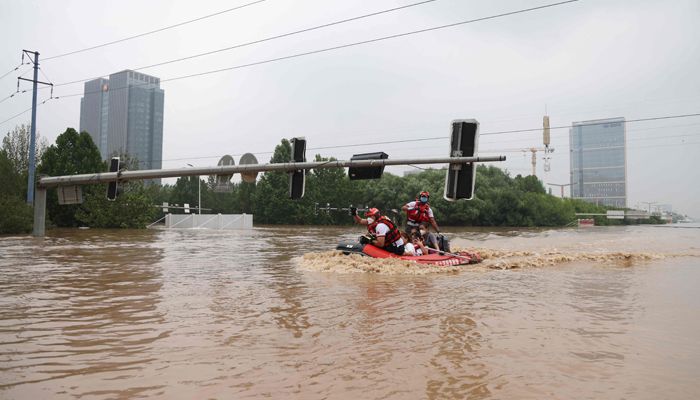 This photo taken on August 2, 2023, shows rescuers evacuating residents after heavy rains in Zhuozhou, in northern Chinaâ€™s Hebei province. — AFP