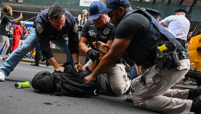 Police arrest people after responding to thousands of people gathered for a “giveaway” event announced by popular Twitch live streamer Kai Cenat in Union Square, New York on Friday. AFP