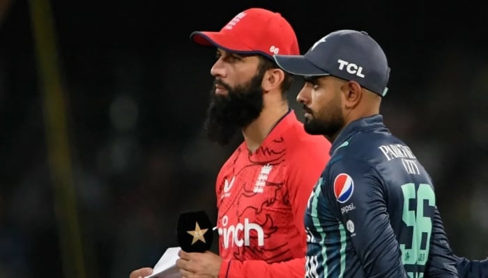 Englands Moeen Ali (left) and Pakistan Skipper Babar Azam during a match. — AFP/File