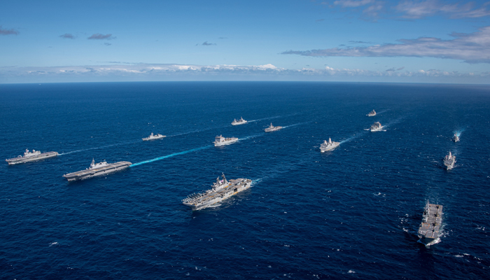 This picture released on July 29, 2023, by US Navy, shows USS America (LHA 6), sailing in formation with the allied vessels during of Exercise Talisman Sabre. — X/@USNavy