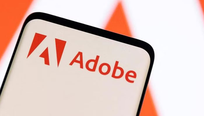 Adobe logo is seen on smartphone in this illustration taken June 13, 2022. — Reuters