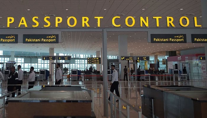 In this photograph taken on April 26, 2018, airport staff walks through the Islamabad International Airport on the outskirts of the federal capital. — AFP