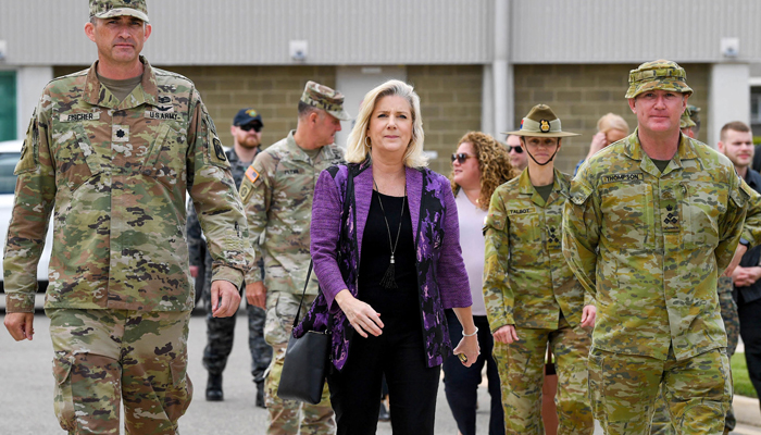 This photo released on August 9, 2023, shows US Secretary of the Army Christine Wormuth (C) walking with senior US and Australian military officials in an unknown location. — AFP