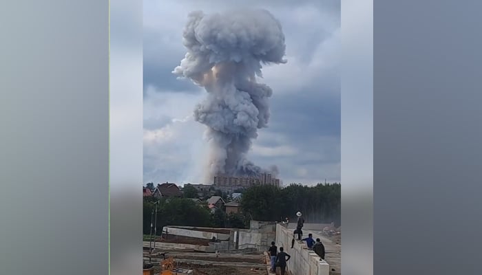 This image taken from a Russian Telegram channel shows a plume of smoke coming out from a factory that suffered a powerful explosion on August 9, 2023. — Telegram/@bbbreaking