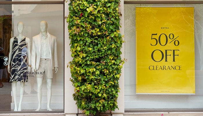 A sale sign greets shoppers at a retail store in Carlsbad, California, US, May 25, 2023. — Reuters