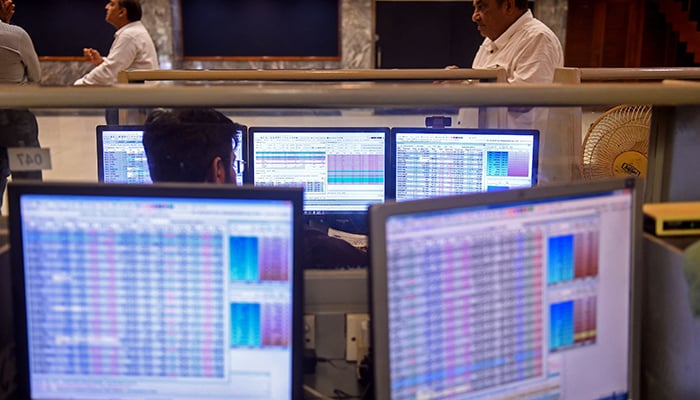 A stockbroker looks at a computer during a trading session at the Pakistan Stock Exchange (PSX) in Karachi on July 31, 2023. — AFP