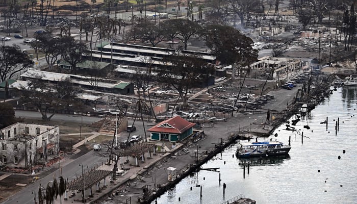 An aerial image taken on August 10, 2023 shows destroyed homes, buildings and boats burned to the ground in Lahaina in the aftermath of wildfires in western Maui, Hawaii. — AFP