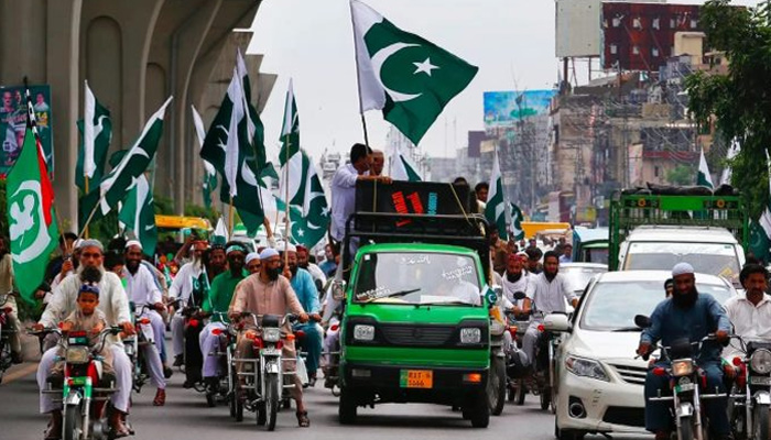 An independence day rally is seen on a road during the 14th August celebrations in this undated image. — APP/File