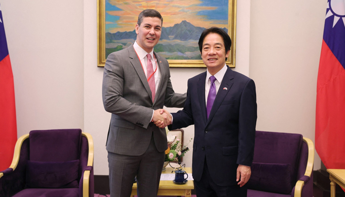 This picture taken on July 12, 2023, shows Taiwans Vice President William Lai (R) shaking hands with Paraguays President-elect Santiago Pena Palacios at the Presidential Office in Taipei. — AFP