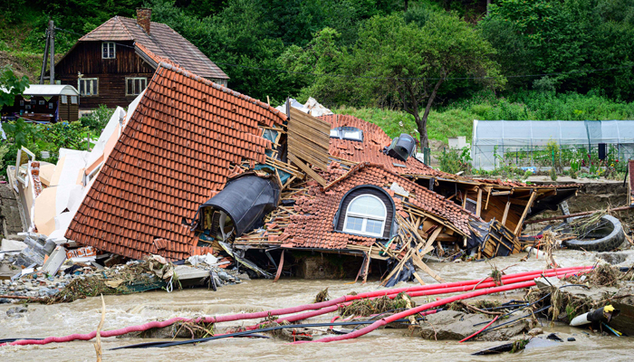 A collapsed house is seen in the river Meza in flood-hit Prevalje, on August 9, 2023. — AFP