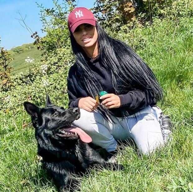 Katie plays with her new pet dog Tank amid a petition to ban her from having pets