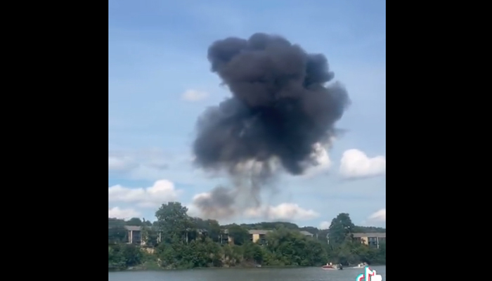 This screengrab shows a thick cloud of smoke after the Soviet-era plane crashed during Thunder Over Michigan air show. — TikTok/@Thehockyguy