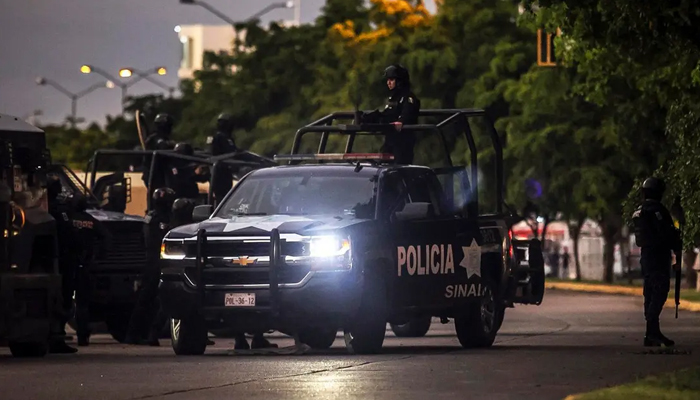 Mexican police patrol in a street of Culiacan, state of Sinaloa, Mexico. — AFP/File