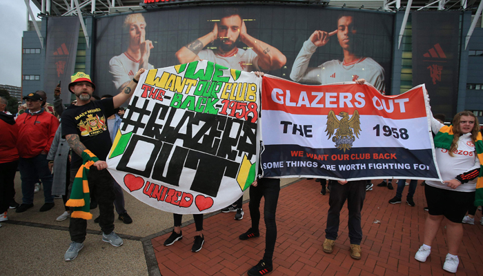 Manchester United fans demonstrate against their owners, the Glazers, ahead of the English Premier League football match between Man Utd and Wolves at Old Trafford in Manchester on August 14, 2023. — AFP