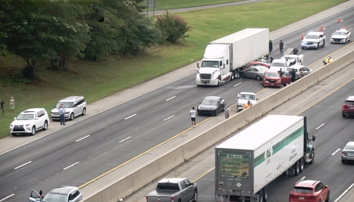 This picture shows Interstate 40 in Durham, North Carolina witnessing heavy traffic with cars wedging into a trailer after a chain crash on August 15, 2023. — Twitter/@NCDOT_Triangle