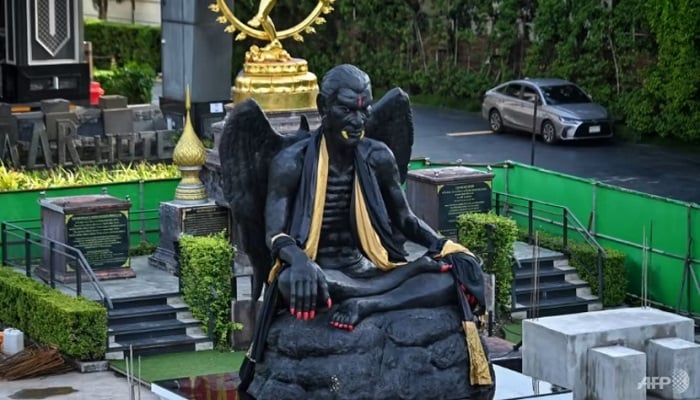 A giant statue of the deity Kru Kai Kaew, regarded by some as a god of wealth but by others as alien to Buddhism, is pictured in Bangkok on Aug 18, 2023.— AFP/File