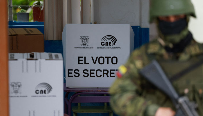 A soldier stands guard at a polling station in Quito during the Ecuadorean presidential election and referendum on mining and petroleum, on August 20, 2023.—AFP