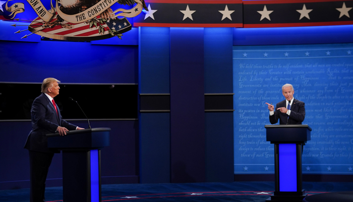 US President Donald Trump (L) and Democratic candidate Joe Biden participate in their final presidential debate at Belmont University in Nashville, Tennessee, on October 22, 2020 — AFP