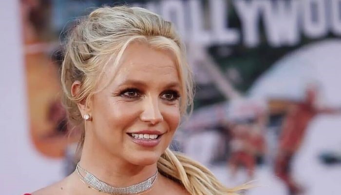 Britney Spears embraces desert heat and unveils snake tattoo