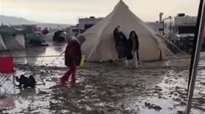 WATCH: Stranded Burning Man visitors share glimpses of flood aftermath