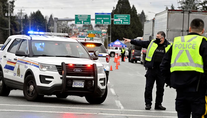 Canadian police officials while inspecting a scene at a border crossing in Surrey, British Columbia, Canada, February 19, 2022. — Reuters