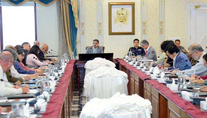 Caretaker Prime Minister Anwaar-ul-Haq Kakar talking to foreign media at his office in Islamabad on September 4, 2023. — PID