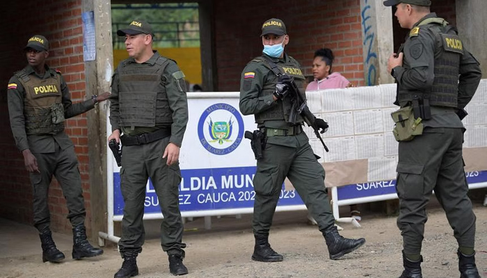 Police officers patrolling Suarez, Colombia, on May 29, 2022. — AFP