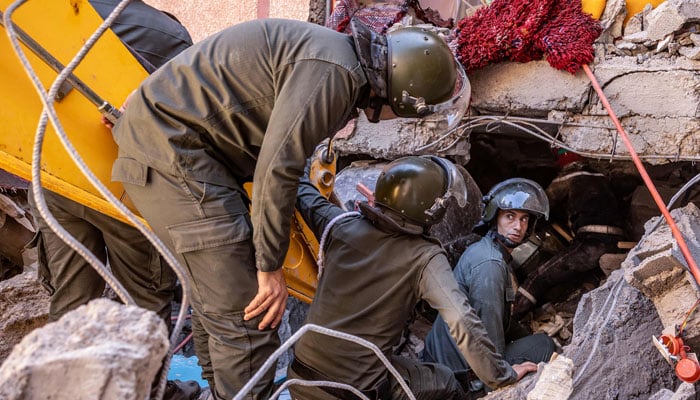 Rescue workers search for survivors in a collapsed house in Moulay Brahim, Al Haouz province in Morocco, on September 9, 2023, after an earthquake. — AFP