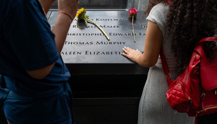 People visit the 9/11 Memorial and Museum at the Ground Zero site in lower Manhattan as the nation prepares to commemorate the 22nd anniversary of the attacks on September 10, 2023 in NYC. — AFP