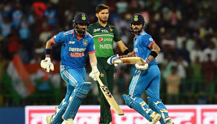 Virat Kohli (R) and KL Rahul (L) run between the wickets during the Asia Cup 2023 super four ODI match between India and Pakistan at the R Premadasa Stadium in Colombo on September 11, 2023. — AFP