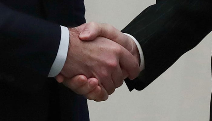 A representational image of a handshake.—AFP/file