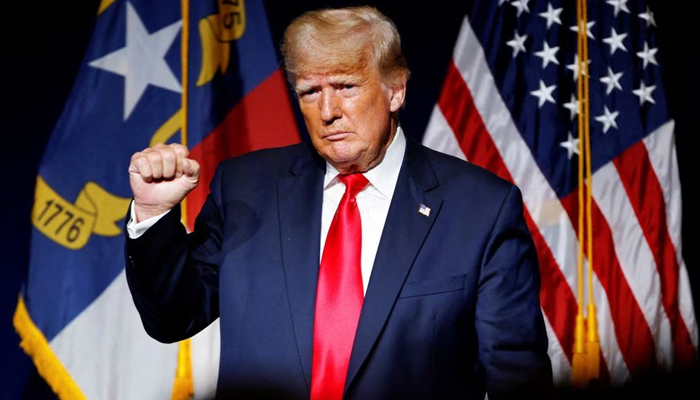 Former US President Donald Trump makes a fist while reacting to applause after speaking at the North Carolina GOP convention dinner in Greenville, North Carolina on June 5, 2021. — Reuters