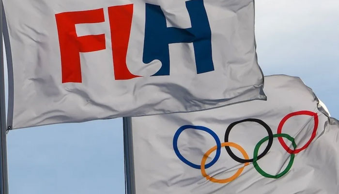 The flags of the International Hockey Federation and Olympics flutter with the air in this undated photo. — FIH