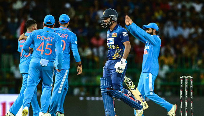 Sri Lanka´s Dimuth Karunaratne (C) walks back to the pavilion after his dismissal during the Asia Cup 2023 Super Four ODI cricket match between India and Sri Lanka at the R. Premadasa Stadium in Colombo on September 12, 2023. — AFP